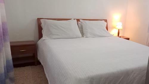 Gastenkamer, Adorable Ring Road Guesthouse in Nyeri Gastenkamer, Adorable Ring Road Guesthouse in Nyeri