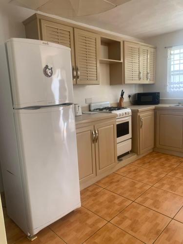 Kitchen, Cool Running Apartments near Maurice Bishop International Airport Kitchen, Cool Running Apartments near Maurice Bishop International Airport