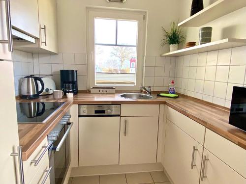 Hygge-skandinavisch-mit-Kamin-und-Sauna in Sierksdorf Hygge-skandinavisch-mit-Kamin-und-Sauna in Sierksdorf