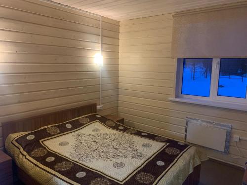 коттедж на озере Врево in วลาดิชิโน коттедж на озере Врево in วลาดิชิโน