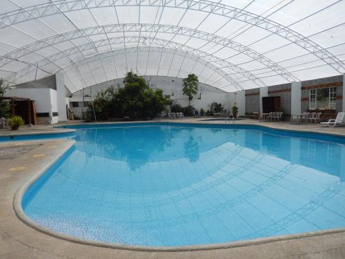Piscina, HOSTERÍA LOS MOLINOS DE YANAYACU (HOSTERIA LOS MOLINOS DE YANAYACU) in Salcedo Piscina, HOSTERÍA LOS MOLINOS DE YANAYACU (HOSTERIA LOS MOLINOS DE YANAYACU) in Salcedo