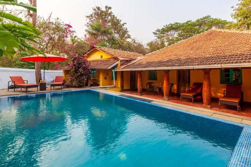 Swimming pool, StayVista at Terra Rosa in Divar Swimming pool, StayVista at Terra Rosa in Divar