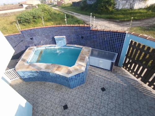 Casa com piscina , churrasqueira, Wi-Fi, em rua de Areia a 1km da praia, bairro sussegado, proibido in 雅尔丁达斯帕尔梅拉斯 Casa com piscina , churrasqueira, Wi-Fi, em rua de Areia a 1km da praia, bairro sussegado, proibido in 雅尔丁达斯帕尔梅拉斯