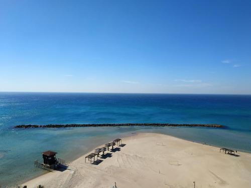 Praia, בניין אלמוג - מגדל הים in Carmel Beach Front Praia, בניין אלמוג - מגדל הים in Carmel Beach Front