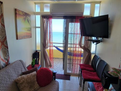 صالة مشتركة/ منطقة التلفزيون, Yaeliz Front Beach in أجوادا صالة مشتركة/ منطقة التلفزيون, Yaeliz Front Beach in أجوادا