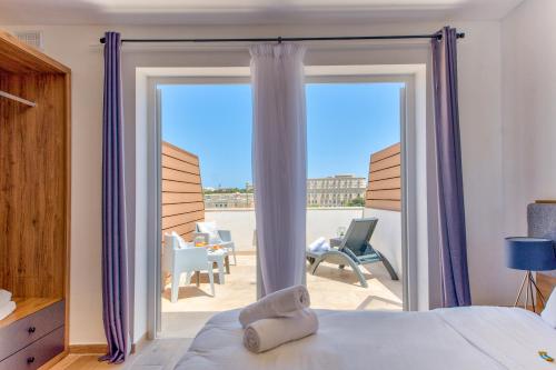 balkong/terrass, Tritoni Valletta Boutique Hotel in Il-Furjana balkong/terrass, Tritoni Valletta Boutique Hotel in Il-Furjana
