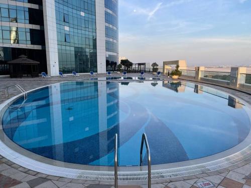 Swimming pool, Cozy Upgraded Residential Flat with sea, Mangrove, pool view - 1203 Not Hotel in Al Mafraq Swimming pool, Cozy Upgraded Residential Flat with sea, Mangrove, pool view - 1203 Not Hotel in Al Mafraq