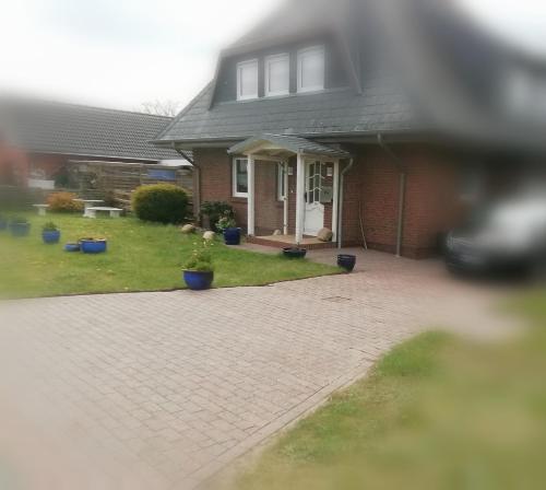 A szálláshely kívülről, Haus Ferchen Gartenzimmer in Enge-Sande A szálláshely kívülről, Haus Ferchen Gartenzimmer in Enge-Sande