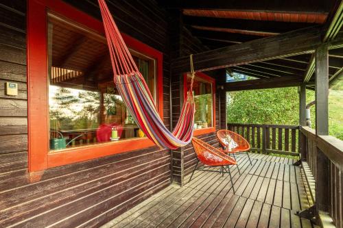 Balcony/terrace, Blockhaus Eifelsteig w/ Kamin Garten & Feuerstelle in Berndorf Balcony/terrace, Blockhaus Eifelsteig w/ Kamin Garten & Feuerstelle in Berndorf