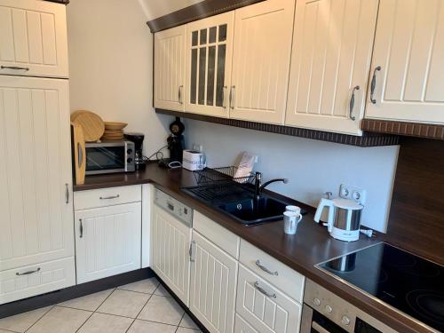 Ferienhaus RH "Strandkieker Middenmang" in Am Deich Ferienhaus RH "Strandkieker Middenmang" in Am Deich