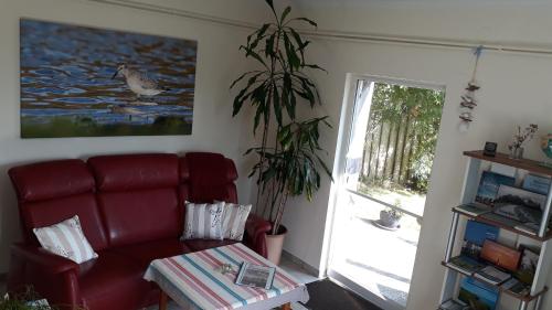 Ferienhaus auf einer Warft in Tetenbüll Ferienhaus auf einer Warft in Tetenbüll