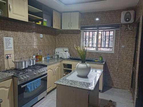 Kitchen, Entire 3-bedroom holiday house with free parking from ETA Group Ltd in Ibadan Kitchen, Entire 3-bedroom holiday house with free parking from ETA Group Ltd in Ibadan