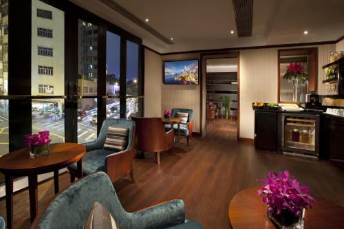 Shared lounge/TV area, Hotel One Eighteen in Causeway Bay Shared lounge/TV area, Hotel One Eighteen in Causeway Bay