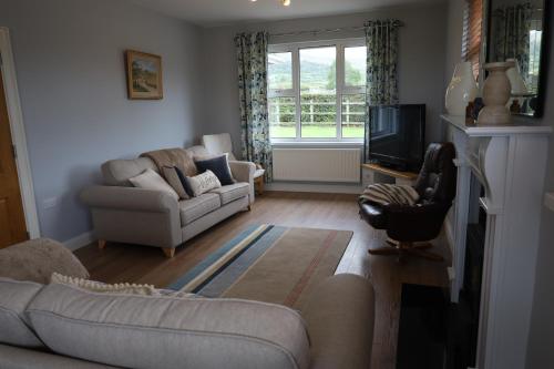 صالة مشتركة/ منطقة التلفزيون, Benbradagh Country Cottage Causeway Coast in دونجيفين صالة مشتركة/ منطقة التلفزيون, Benbradagh Country Cottage Causeway Coast in دونجيفين