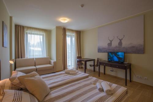 Felles stue/TV-område, Euphoria Club and Resort Rental in Borovets Felles stue/TV-område, Euphoria Club and Resort Rental in Borovets