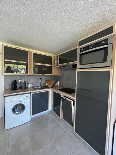 kuhinja, Le Studio de la Lagune studio cabine proche de la plage in Le Grau-du-Roi kuhinja, Le Studio de la Lagune studio cabine proche de la plage in Le Grau-du-Roi