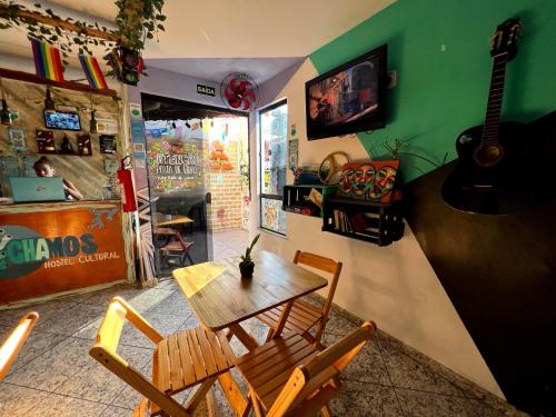 Shared lounge/TV area, Chamos Hostel Cultural in Praia dos Anjos Shared lounge/TV area, Chamos Hostel Cultural in Praia dos Anjos