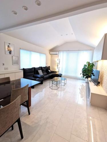Shared lounge/TV area, Bell house in Setagaya Shared lounge/TV area, Bell house in Setagaya