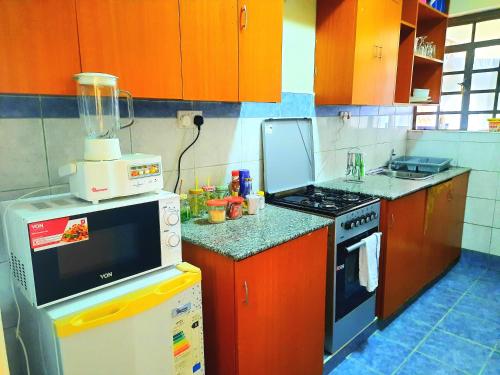 kuchnia, Cozy Nest-2 Bedroomed Apartment WiFi ,Netflix close to JKIA in Mlolongo kuchnia, Cozy Nest-2 Bedroomed Apartment WiFi ,Netflix close to JKIA in Mlolongo
