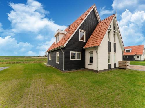 Exterior view, Modern detached holiday home a stone's throw from the beach in Tholen Exterior view, Modern detached holiday home a stone's throw from the beach in Tholen