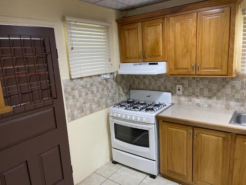 Kitchen, Arlene's Nest Diego Martin - 3 Bedroom 1 & half bath Cozy Apt in Diego Martin Kitchen, Arlene's Nest Diego Martin - 3 Bedroom 1 & half bath Cozy Apt in Diego Martin