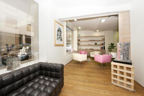 gedeelde lounge/tv-ruimte, Hotel Touring in Pisa gedeelde lounge/tv-ruimte, Hotel Touring in Pisa