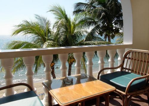 Balcony/terrace, Squares Beachfront Apartments near Aninuan Falls Balcony/terrace, Squares Beachfront Apartments near Aninuan Falls