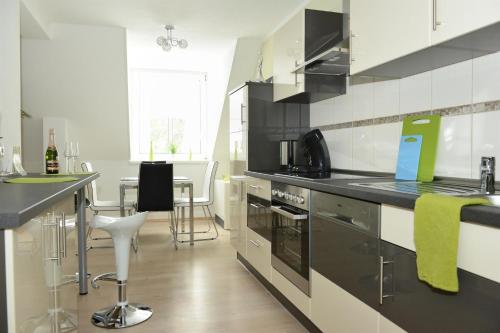 Konyha, AMF Ferienwohnungen historischer Soutyhof in Saarlouis Konyha, AMF Ferienwohnungen historischer Soutyhof in Saarlouis