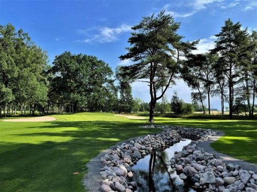 Campo de golf en el alojamiento, Lillstuga Vanern in Lidkoping Campo de golf en el alojamiento, Lillstuga Vanern in Lidkoping