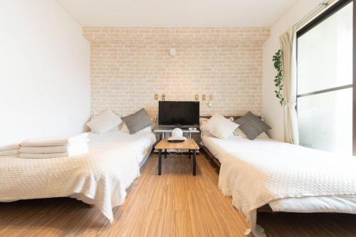 Sanacion Motomachi 6 なんば徒歩圏内 Netflix視聴可能 2部屋セット貸しでプライベートも確保