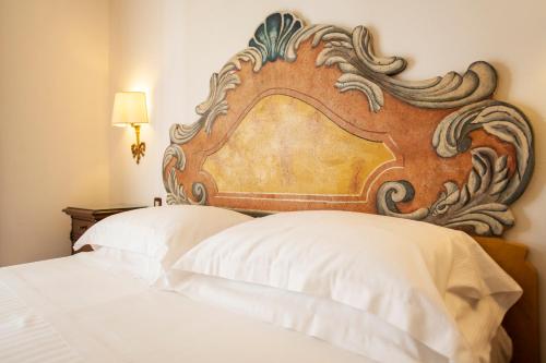 Cama, Fattoria La Principina Hotel & Congress in Grosseto Cama, Fattoria La Principina Hotel & Congress in Grosseto