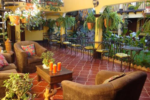 Shared lounge/TV area, Hotel Las Camelias Inn by AHS in Antigua Guatemala Shared lounge/TV area, Hotel Las Camelias Inn by AHS in Antigua Guatemala