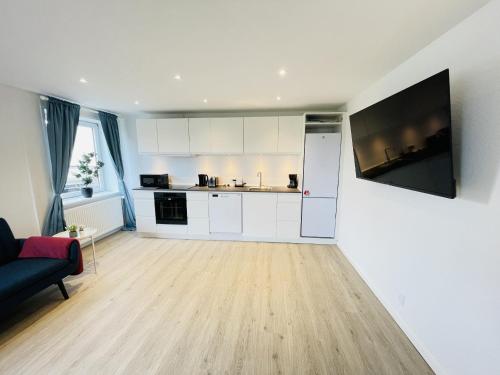 共用Lounge/電視區, aday - Blue Sea apartment with balcony in 腓特烈港市中心 共用Lounge/電視區, aday - Blue Sea apartment with balcony in 腓特烈港市中心