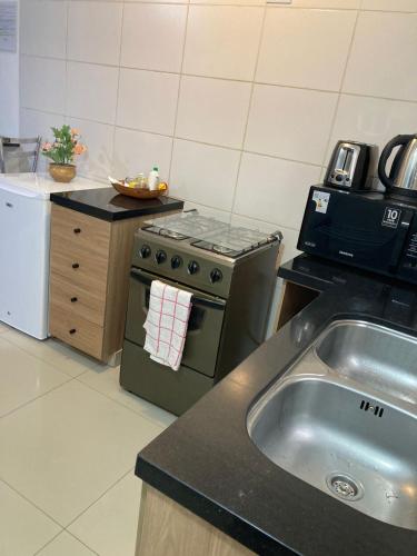 Kitchen, Departamento Planta Baja con parqueo en Condominio in Santa Cruz Kitchen, Departamento Planta Baja con parqueo en Condominio in Santa Cruz