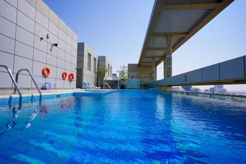 Swimming pool, Alashrafia Saray- Superior 1BR apartment in Sport City near Dubai Sports City Swimming pool, Alashrafia Saray- Superior 1BR apartment in Sport City near Dubai Sports City