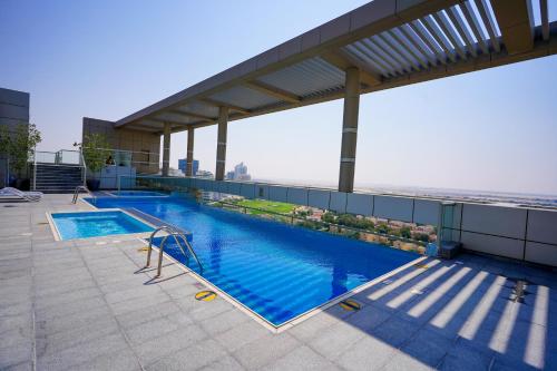 Swimming pool, Alashrafia Saray- Superior 1BR apartment in Sport City near Dubai Sports City Swimming pool, Alashrafia Saray- Superior 1BR apartment in Sport City near Dubai Sports City