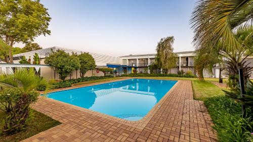 Piscina, African Sky Newcastle Inn in Newcastle Piscina, African Sky Newcastle Inn in Newcastle