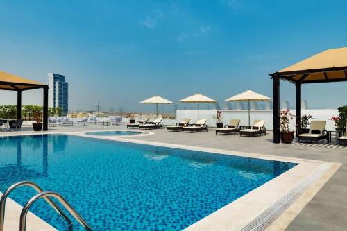 Swimming pool, Four Points by Sheraton Production City, Dubai in Dubailand Swimming pool, Four Points by Sheraton Production City, Dubai in Dubailand