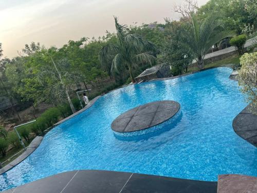 Swimming pool, Apple Farmhouse Entire 3 BHK with a Pool in Sohna Swimming pool, Apple Farmhouse Entire 3 BHK with a Pool in Sohna