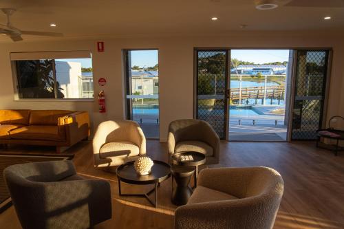 Shared lounge/TV area, Mackay Adventure Lodge in Mackay Shared lounge/TV area, Mackay Adventure Lodge in Mackay