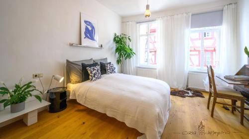 سرير, Casa Wimpina - geschmackvolles Appartement im Herzen der Altstadt in Bad Wimpfen سرير, Casa Wimpina - geschmackvolles Appartement im Herzen der Altstadt in Bad Wimpfen