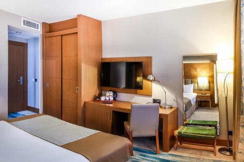 חדר שינה, SYM Hôtel (SYM Hotel) in צ'ראגה חדר שינה, SYM Hôtel (SYM Hotel) in צ'ראגה
