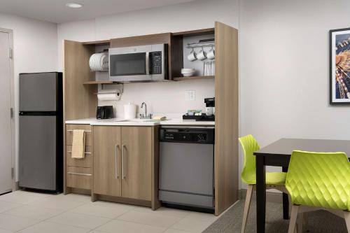Kitchen, Home2 Suites by Hilton Orlando Downtown in Downtown Kitchen, Home2 Suites by Hilton Orlando Downtown in Downtown