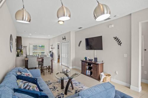 Shared lounge/TV area, Luxury and tranquility, In the Heart of Poinciana, just 30 min from Disney! in Poinciana Shared lounge/TV area, Luxury and tranquility, In the Heart of Poinciana, just 30 min from Disney! in Poinciana