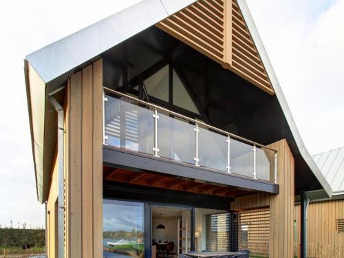 Exterior view, Modern lodge on the water in a national park in Tholen Exterior view, Modern lodge on the water in a national park in Tholen