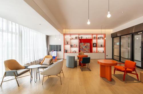 Shared lounge/TV area, Keypai Hotel in Huangpu District Shared lounge/TV area, Keypai Hotel in Huangpu District
