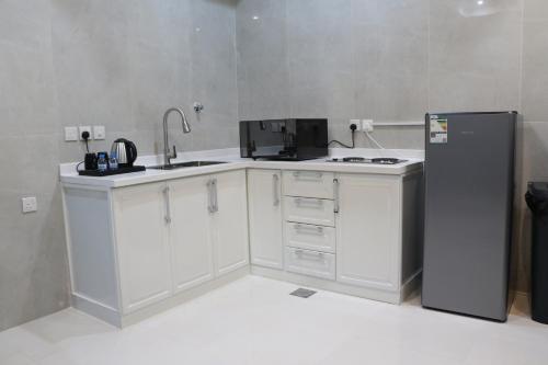 Kitchen, شقق بيت المدينة للشقق المخدومة in Mudhainib Kitchen, شقق بيت المدينة للشقق المخدومة in Mudhainib
