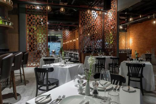 Restaurant, The Fives Downtown Hotel and Residences Curio Collection by Hilton in Playa Del Carmen Restaurant, The Fives Downtown Hotel and Residences Curio Collection by Hilton in Playa Del Carmen
