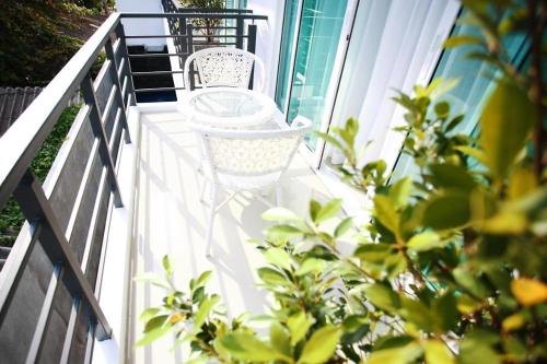 Balcony/terrace, One World One Home Naiharn Hotel in Nai Harn Beach Balcony/terrace, One World One Home Naiharn Hotel in Nai Harn Beach