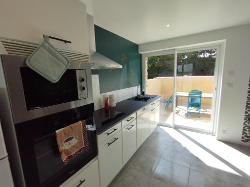 Konyha, Jolie maison au calme et proche mer avec spa en option in Les Pieux Konyha, Jolie maison au calme et proche mer avec spa en option in Les Pieux